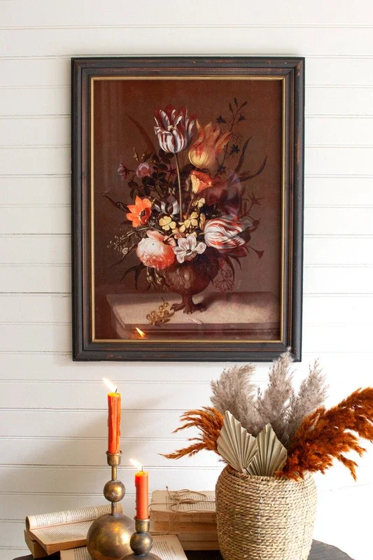 Framed still life print under glass