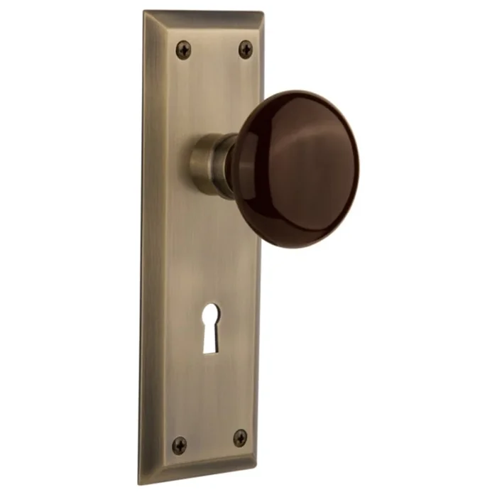 Nostalgic Warehouse Brown Porcelain Solid Brass Privacy Door Knob Set with New York Rose, Keyhole and 2-3/8″ Backset