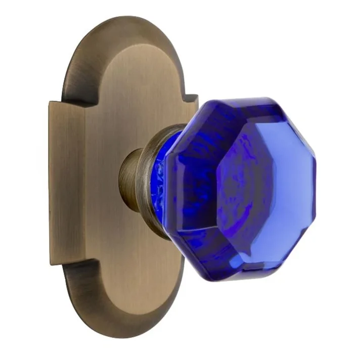 Nostalgic Warehouse Cottage Solid Brass Rose Passage Door Knob Set with Cobalt Waldorf Knob and 2-3/4″ Backset