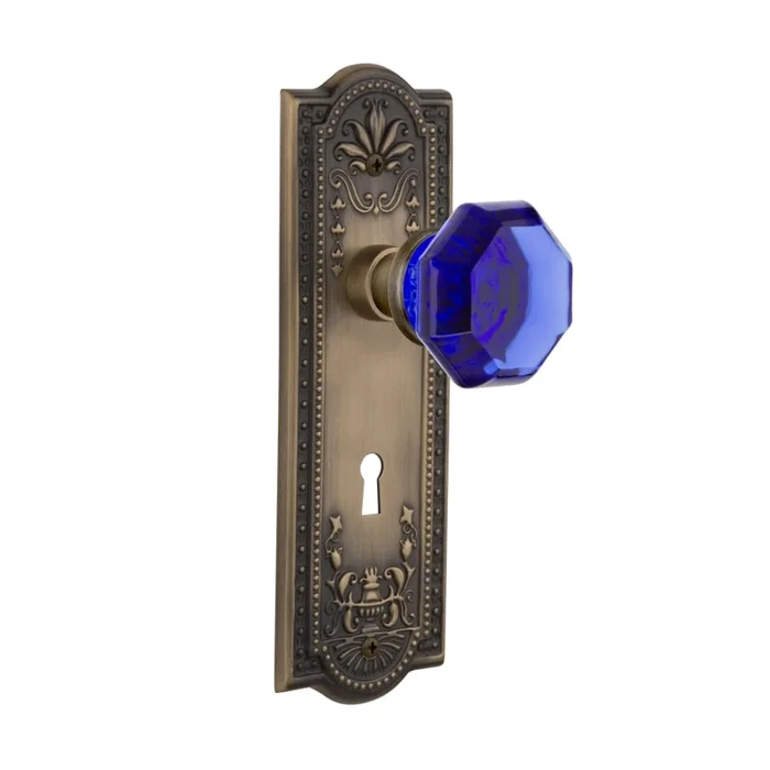 Nostalgic Warehouse Meadows Solid Brass Rose Passage Door Knob Set with Cobalt Waldorf Door Knob and Decorative Keyhole for 2-3/4″ Backset