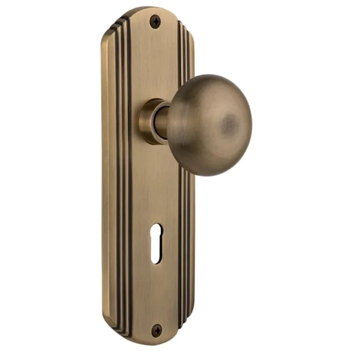 Nostalgic Warehouse New York Solid Brass Passage Door Knob Set with Deco Rose and 2-3/8″ Backset