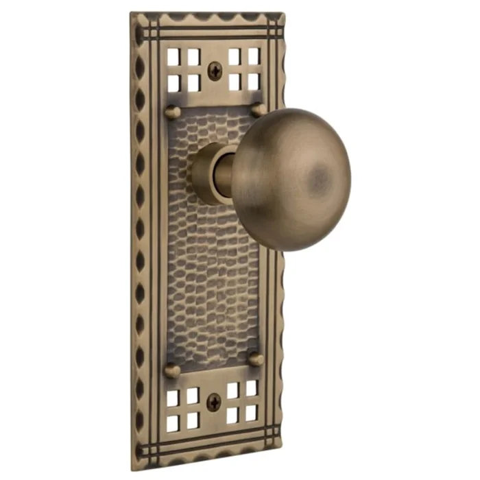 Nostalgic Warehouse New York Solid Brass Passage Door Knob Set with Long Craftsman Plate and 2-3/8″ Backset
