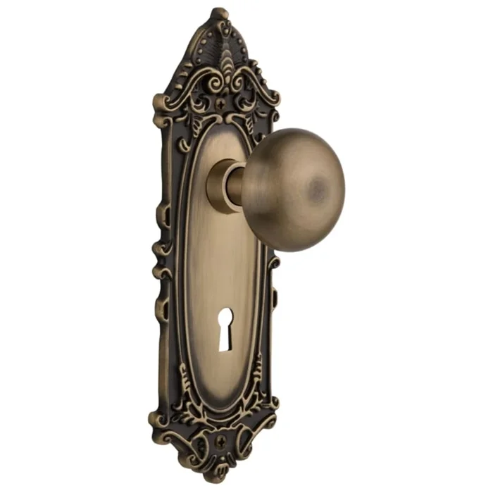 Nostalgic Warehouse New York Solid Brass Passage Door Knob Set with Victorian Rose, Keyhole and 2-3/8″ Backset