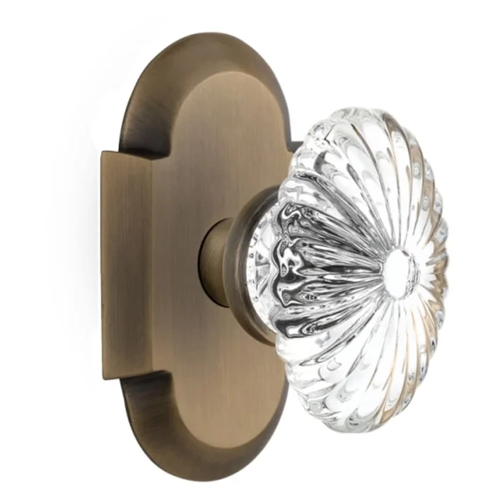 Nostalgic Warehouse Vintage Farmhouse Oval Fluted Crystal Flower Privacy Door Knob Set with Solid Brass Cottage Style Plate and 2-3/4″ Backset