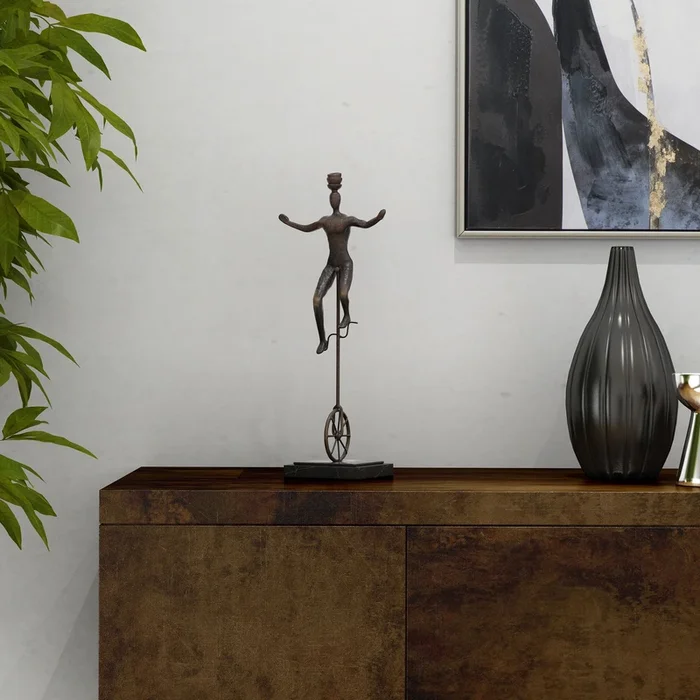 Unicycle balancing act sculpture